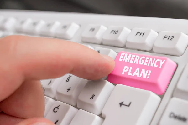 Writing note showing Emergency Plan. Business photo showcasing actions developed to mitigate damage of potential events White pc keyboard with note paper above the white background. — Stock Photo, Image