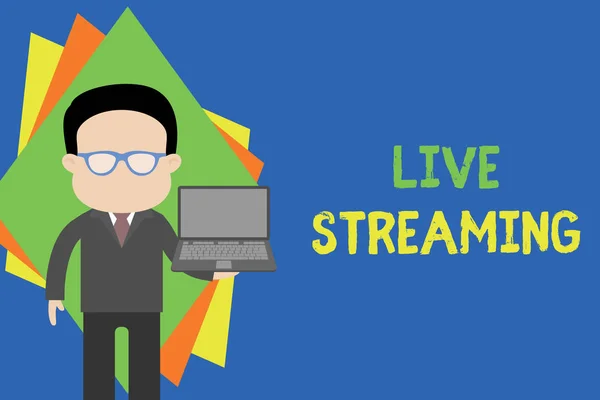 Text sign showing Live Streaming. Conceptual photo Transmit live video coverage of an event over the Internet Standing man in suit wearing eyeglasses holding open laptop photo Art.