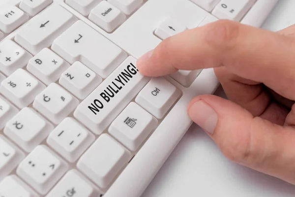 Text sign showing No Bullying. Conceptual photo stop aggressive behavior among children power imbalance White pc keyboard with empty note paper above white background key copy space. — Stock Photo, Image