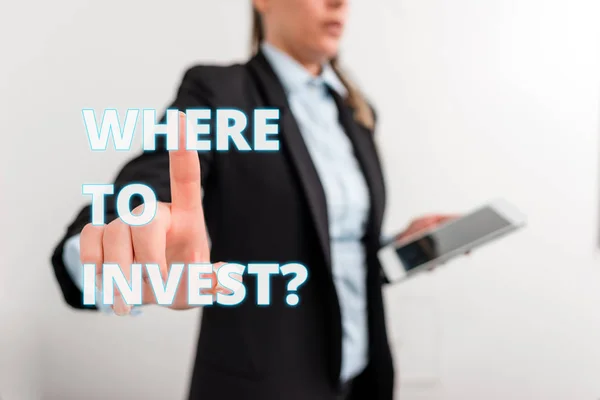 Conceptual hand writing showing Where To Invest question. Business photo text asking about actions or process of making more money Digital business in black suite concept with business woman. — Stock Photo, Image