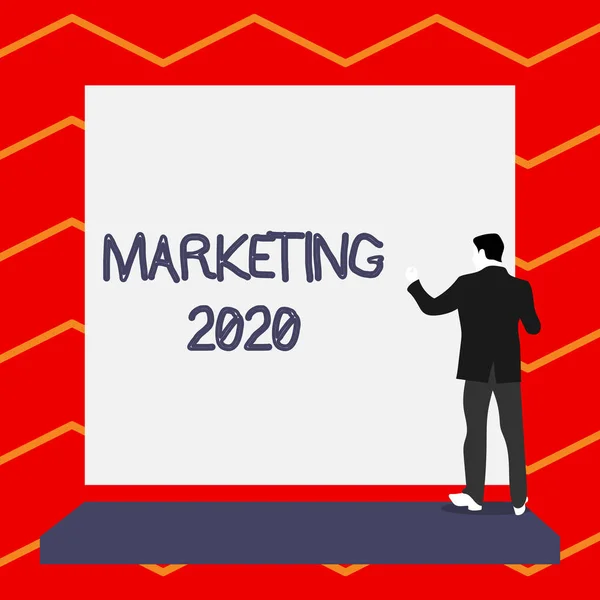 Word writing text Marketing 2020. Business concept for Commercial trends for 2020 New Year promotional event Short hair immature young man stand in front of rectangle big blank board.