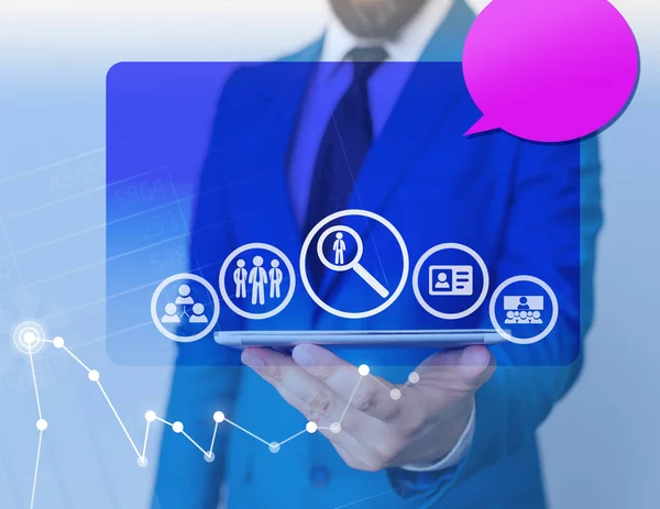 Searching employee team register connect meeting recruiting icons and man holding a smartphone tablet computer in blue screen. Pink empty speech bubble. Office business concept. — Stock Photo, Image