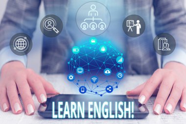 Conceptual hand writing showing Learn English. Business photo text gain acquire knowledge in new language by study Female human wear formal work suit presenting smart device. clipart