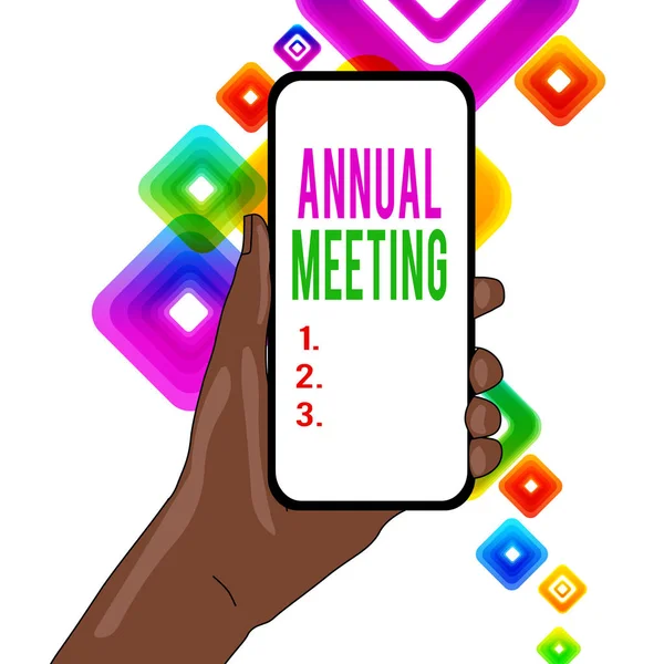 Writing note showing Annual Meeting. Business photo showcasing yearly meeting of the general membership of an organization Closeup of Smartphone Device Held in Hand and Text Space.