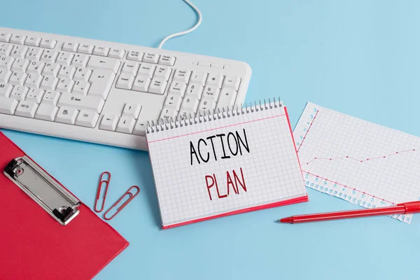 Writing note showing Action Plan. Business photo showcasing detailed plan outlining actions needed to reach goals or vision Paper blue keyboard office study notebook chart numbers memo.