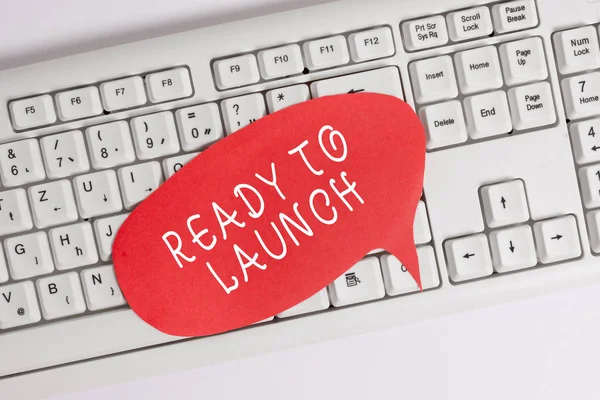 Handwriting text writing Ready To Launch. Concept meaning an event to celebrate or introduce something new to market Empty copy space red note paper bubble above pc keyboard for text message.
