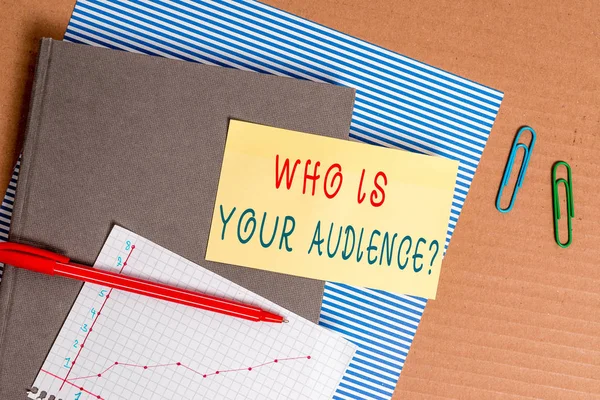 Handwriting text Who Is Your Audience Question. Concept meaning who is watching or listening to it Striped paperboard notebook cardboard office study supplies chart paper.