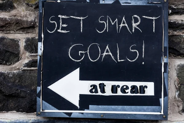 Word writing text Set Smart Goals. Business concept for list to clarify your ideas focus efforts use time wisely Advertisement concept with empty copy space on the road sign.