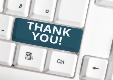 Handwriting text writing Thank You. Concept meaning polite expression used when acknowledging gift service compliment White pc keyboard with empty note paper above white background key copy space. clipart