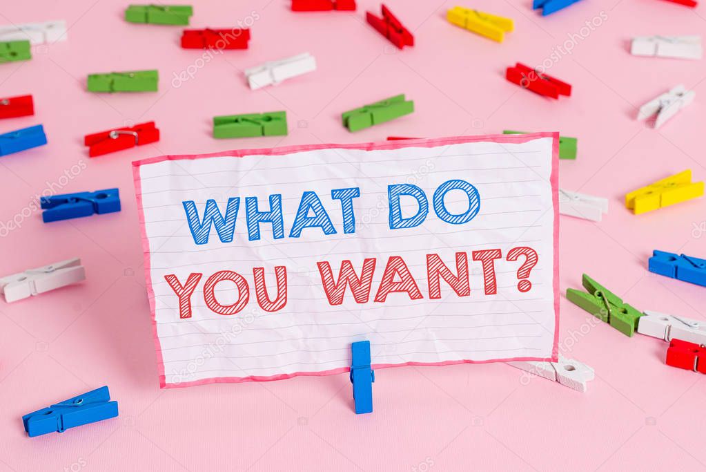 Text sign showing What Do You Want Question. Conceptual photo say or write in order to ask demonstrating about something Colored clothespin papers empty reminder pink floor background office pin.