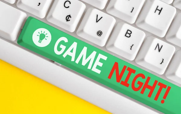 Text sign showing Game Night. Conceptual photo usually its called on adult play dates like poker with friends White pc keyboard with empty note paper above white background key copy space. — Stock Photo, Image