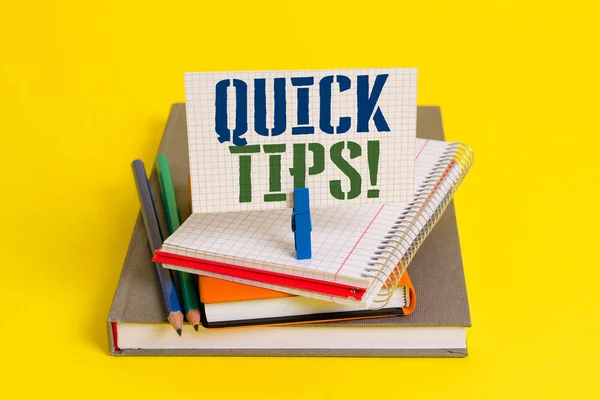 Writing note showing Quick Tips. Business photo showcasing small but particularly useful piece of practical advice Book pencil rectangle shaped reminder notebook clothespins.