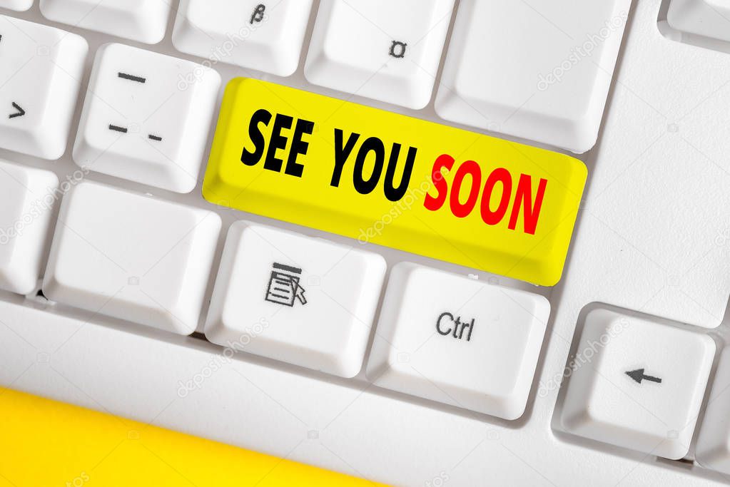 Text sign showing See You Soon. Business photo text used for saying goodbye to someone and going to meet again soon White pc keyboard with empty note paper above white background key copy space