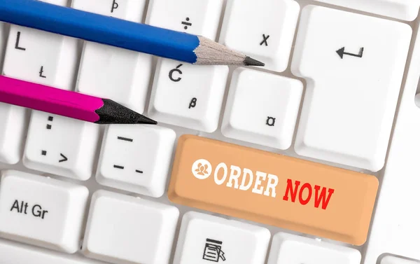 Word writing text Order Now. Business concept for the activity of asking for goods or services from a company White pc keyboard with empty note paper above white background key copy space. — Stock Photo, Image