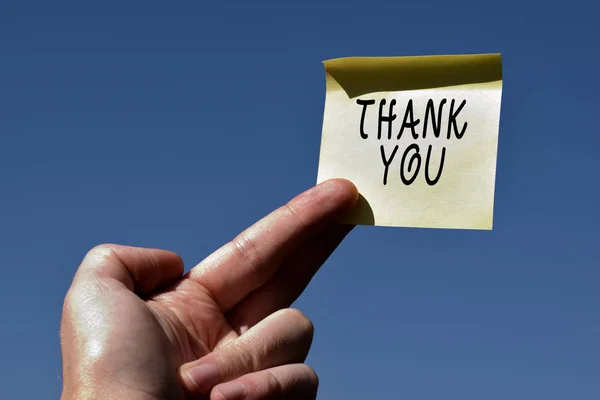 Conceptual hand writing showing Thank You. Business photo text a polite expression used when acknowledging a gift or service Square paper piece notation stick to textured glass window. — Stock Photo, Image