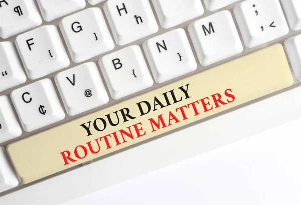 Writing note showing Your Daily Routine Matters. Business photo showcasing practice of regularly doing things in fixed order White pc keyboard with note paper above the white background. — Stock Photo, Image