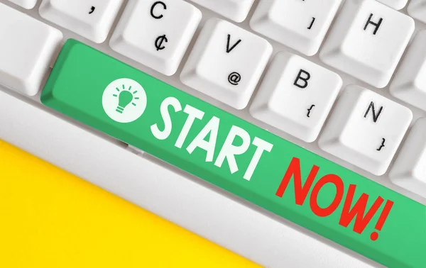 Text sign showing Start Now. Conceptual photo do not hesitate get working or doing stuff right away White pc keyboard with empty note paper above white background key copy space.