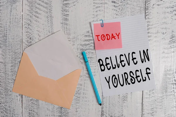 Writing note showing Believe In Yourself. Business photo showcasing common piece of advice that you can do everything Envelope blank sheet sticky note ballpoint wooden background. — Stock Photo, Image
