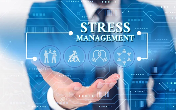 Writing note showing Stress Management. Business photo showcasing method of limiting stress and its effects by learning ways Male wear formal work suit presenting presentation smart device.