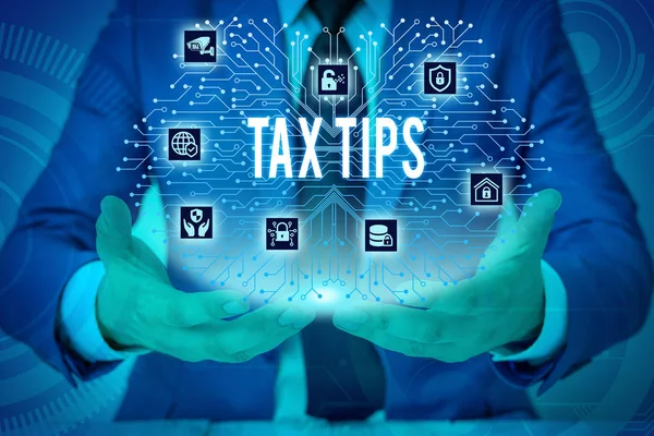 Text sign showing Tax Tips. Conceptual photo compulsory contribution to state revenue levied by government Male human wear formal work suit presenting presentation using smart device. — Stock Photo, Image