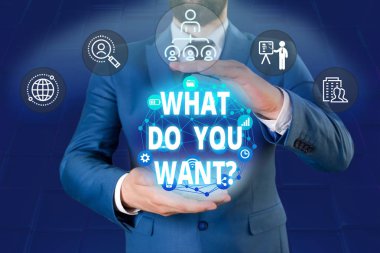 Ne İstiyorsanız Sorusu gösteren not yazma. İş fotoğraf vitrin söylemek ya da yazmak amacıyla bir şey hakkında gösteren sormak için Erkek insan giymek resmi iş elbisesi akıllı cihaz kullanarak sunan.