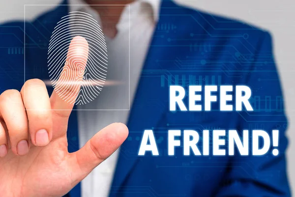 Conceptual hand writing showing Refer A Friend. Business photo text direct someone to another or send him something like gift Male wear formal work suit presenting presentation smart device. — Stock Photo, Image