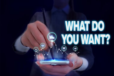 Ne İstiyorsanız Sorusu gösteren not yazma. İş fotoğraf vitrin söylemek ya da yazmak amacıyla bir şey hakkında gösteren sormak için Kadın akıllı kullanarak sunum sunan resmi iş elbisesi giymek