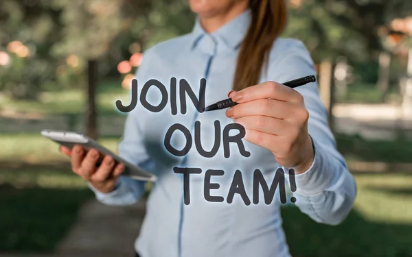 Conceptual hand writing showing Join Our Team. Business photo text inviting someone into your local group or company Woman in a blue shirt pointing with her finger into empty space. — Stock Photo, Image