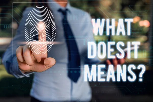 Conceptual hand writing showing What Does It Means question. Business photo showcasing asking someone about meaning something said and you do not understand Woman wear work suit presenting