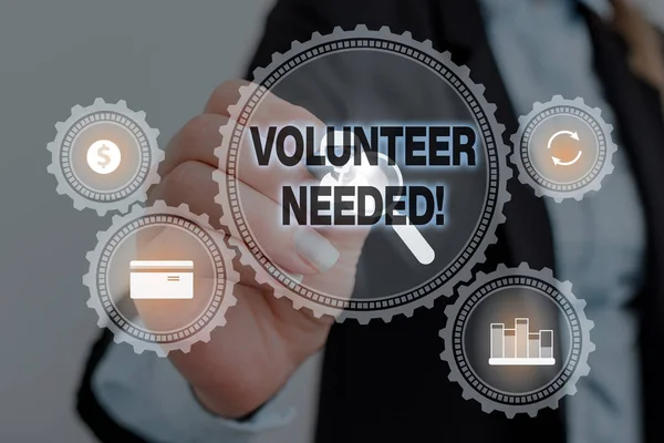 Text sign showing Volunteer Needed. Conceptual photo need work for organization without being paid Woman wear formal work suit presenting presentation using smart device.