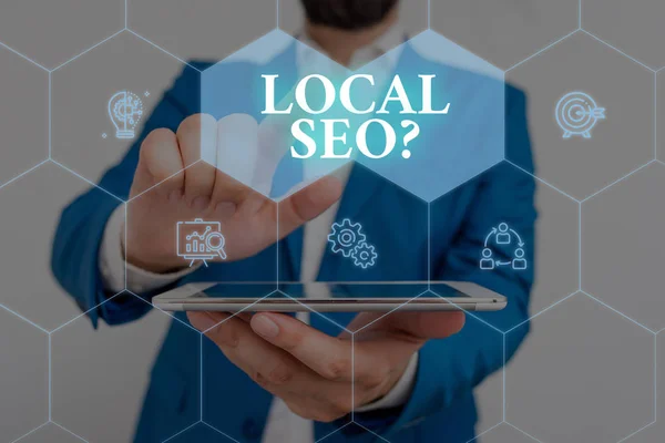 Writing note showing Local Seoquestion. Business photo showcasing incredibly effective way to market your local business online Male wear formal work suit presenting presentation smart device. — Stock Photo, Image