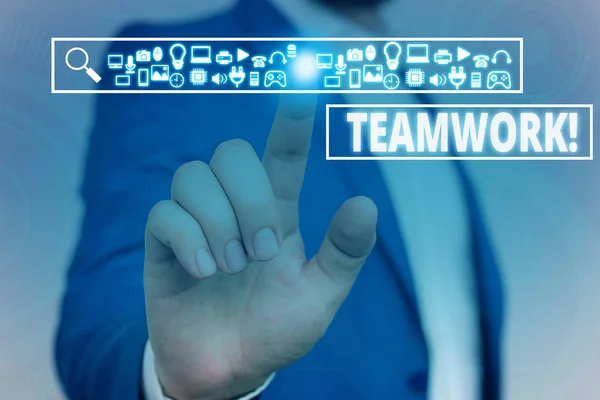 Text sign showing Teamwork. Conceptual photo combined action of group especially when effective and efficient Male human wear formal work suit presenting presentation using smart device. — Stock Photo, Image