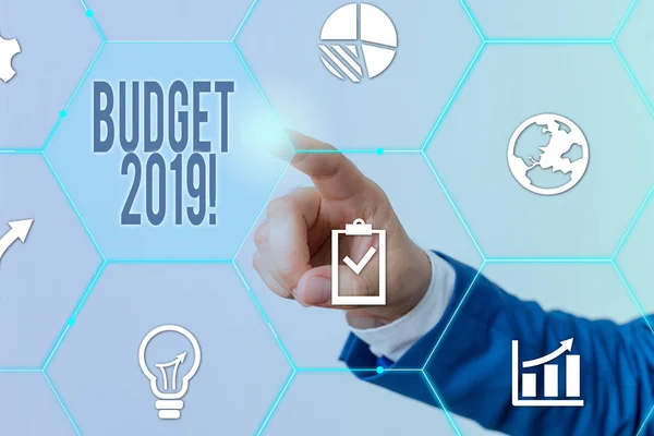 Conceptual hand writing showing Budget 2019. Business photo showcasing the estimate of income and expenditure for current year Male human wear formal suit presenting using smart device. — Stock Photo, Image