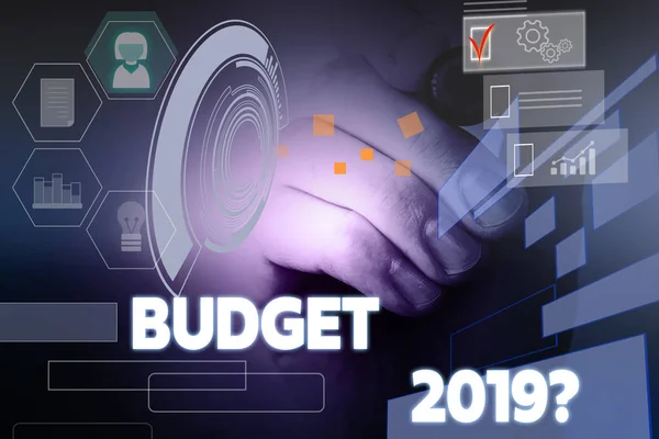 Text sign showing Budget 2019 Question. Conceptual photo estimate of income and expenditure for next year Male human wear formal work suit presenting presentation using smart device. — Stock Photo, Image