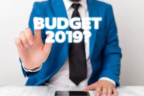 Handwriting text writing Budget 2019 Question. Concept meaning estimate of income and expenditure for next year Businessman with pointing finger in front of him. — Stock Photo, Image