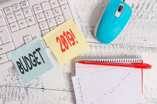 Handwriting text writing Budget 2019. Concept meaning estimate of income and expenditure for current year Writing equipments and computer stuffs placed above classic wooden table. — 스톡 사진