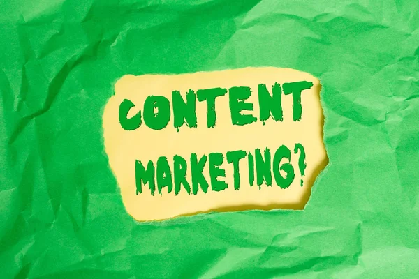 Writing note showing Content Marketing question. Business photo showcasing involves creation and sharing of online material Green crumpled colored paper sheet torn colorful background.