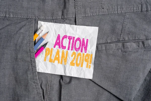 Text sign showing Action Plan 2019. Conceptual photo proposed strategy or course of actions for current year Writing equipment and white note paper inside pocket of man work trousers.