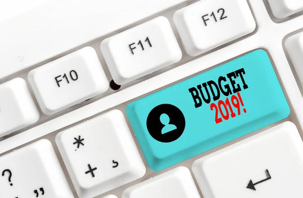 Conceptual hand writing showing Budget 2019. Business photo showcasing the estimate of income and expenditure for current year White pc keyboard with note paper above the white background. — Stock Photo, Image