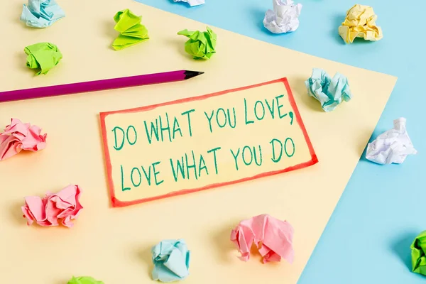 Writing note showing Do What You Love Love What You Do. Business photo showcasing you able doing stuff you enjoy it to work in better places then Colored crumpled papers empty reminder blue yellow — Stock Photo, Image