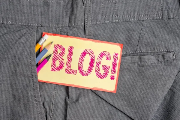 Conceptual hand writing showing Blog. Business photo showcasing regularly updated website web page run by individual or group Writing equipment and yellow notepaper in pocket of trousers.