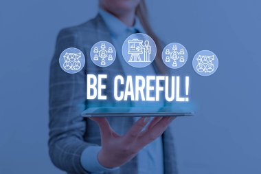 Writing note showing Be Careful. Business photo showcasing making sure of avoiding potential danger mishap or harm Woman wear formal work suit presenting presentation using smart device. clipart