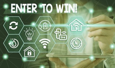 Conceptual hand writing showing Enter To Win. Business photo showcasing exchanging something value for prize chance winning prize Female human wear formal work suit presenting smart device.