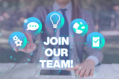 Text sign showing Join Our Team. Conceptual photo invite someone to work together for particular purpose target Female human wear formal work suit presenting presentation use smart device.