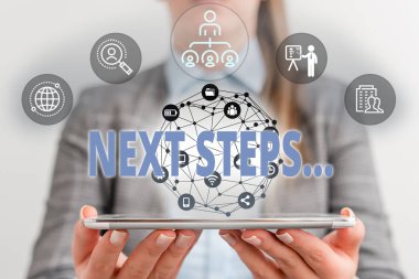 Writing note showing Next Steps. Business photo showcasing something you do after you have finished doing first one Female human wear formal work suit presenting smart device.