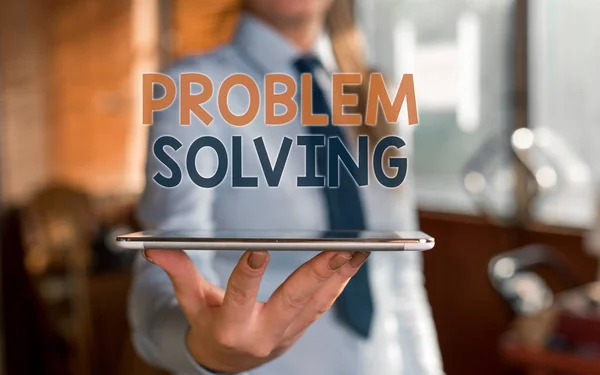 Writing note showing Problem Solving. Business photo showcasing process of finding solutions to difficult or complex issues Blurred woman in the background pointing with finger in empty space.