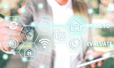 Handwriting text Time To Evaluate. Concept meaning judge something with respect to its worth or significance Female human wear formal work suit presenting presentation use smart device.