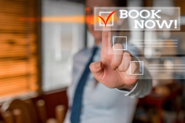 Word writing text Book Now. Business concept for guaranteed to have place because you have already purchased it Woman standing Looking camera showing pointing the copy space bullet points.