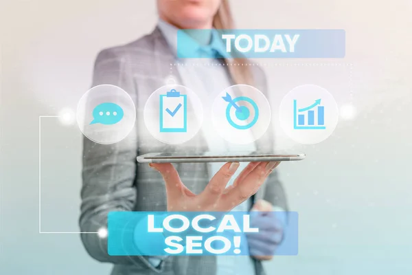 Writing note showing Local Seo. Business photo showcasing incredibly effective way to market your near business online Female human wear formal work suit presenting smart device. — 스톡 사진
