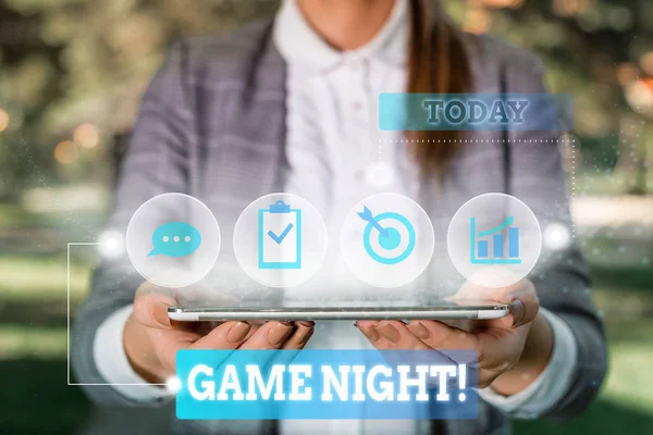 Word writing text Game Night. Business concept for usually its called on adult play dates like poker with friends Female human wear formal work suit presenting presentation use smart device. — Stockfoto